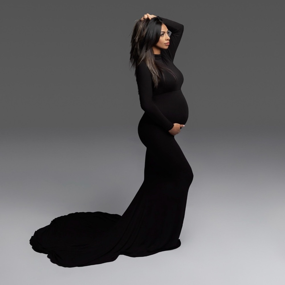 Black turtleneck maternity dress with a train